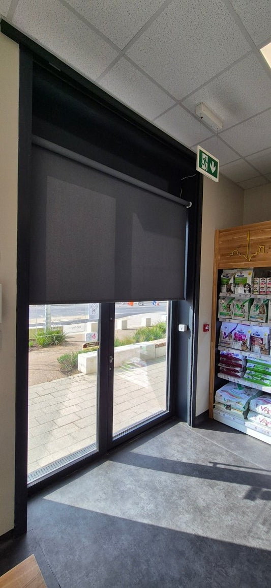 Somfy motorised anthracite blackout roller blinds - Manor Interiors