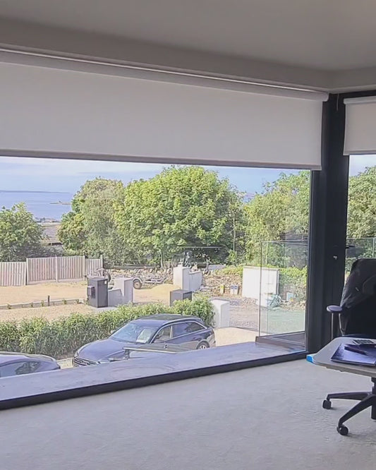Somfy motorised white blackout roller blinds
